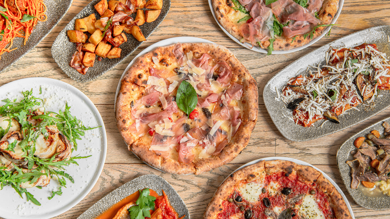 A spread of pizzas, pastas and starters