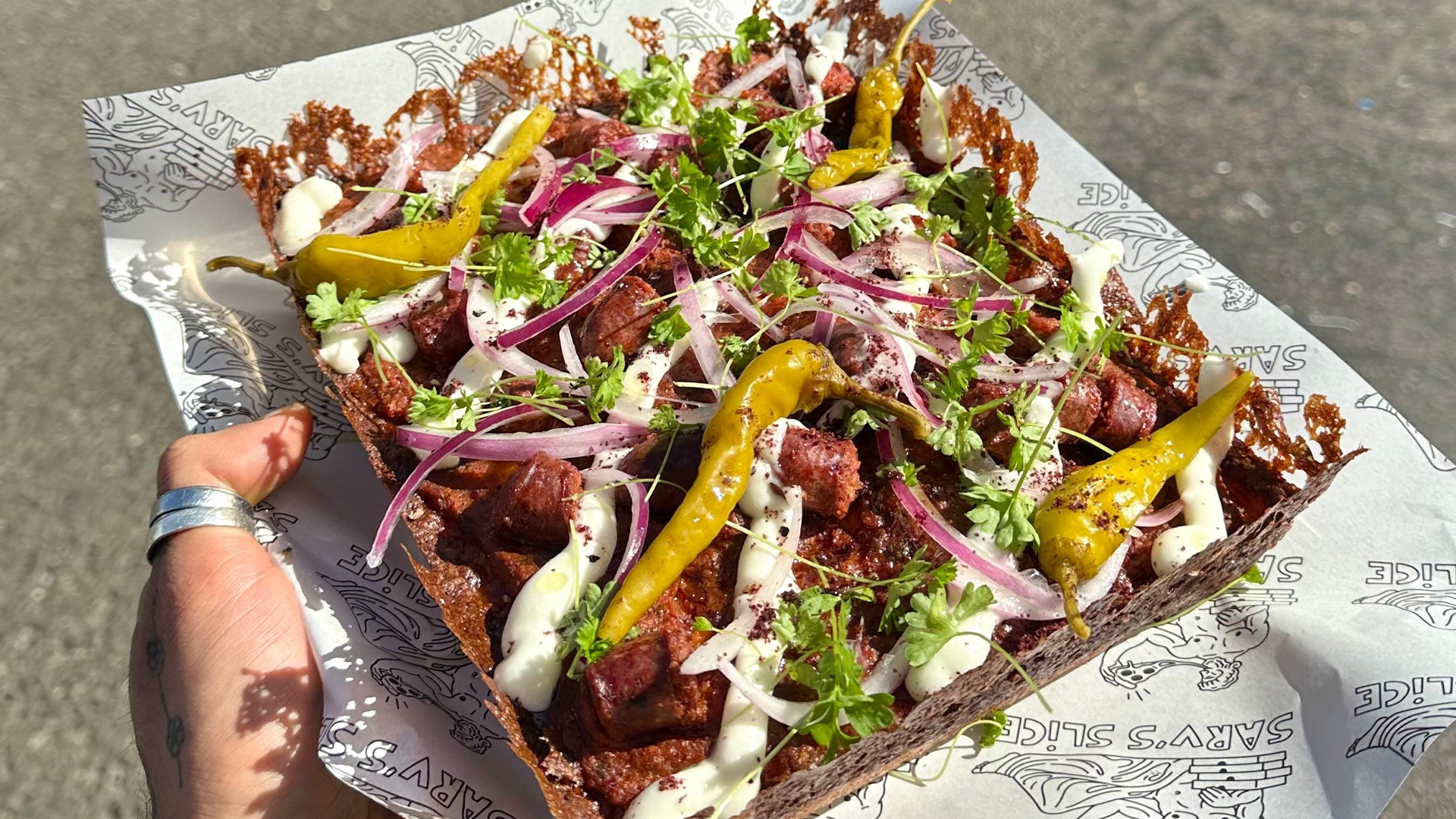 A Detroit-style pizza pie with peppers, onions and salami