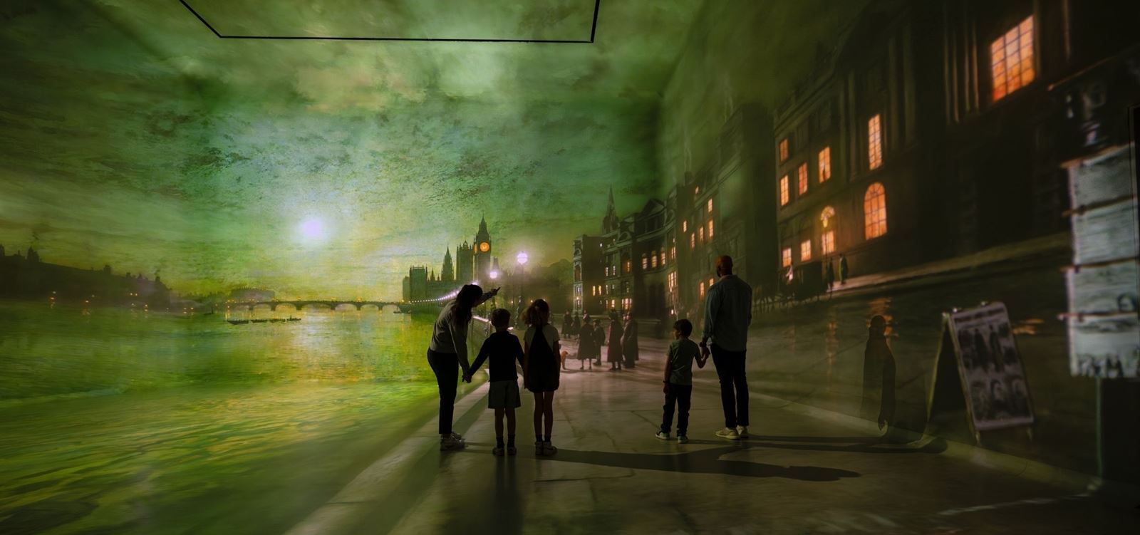 A family of three immersed in a night scene of an artwork