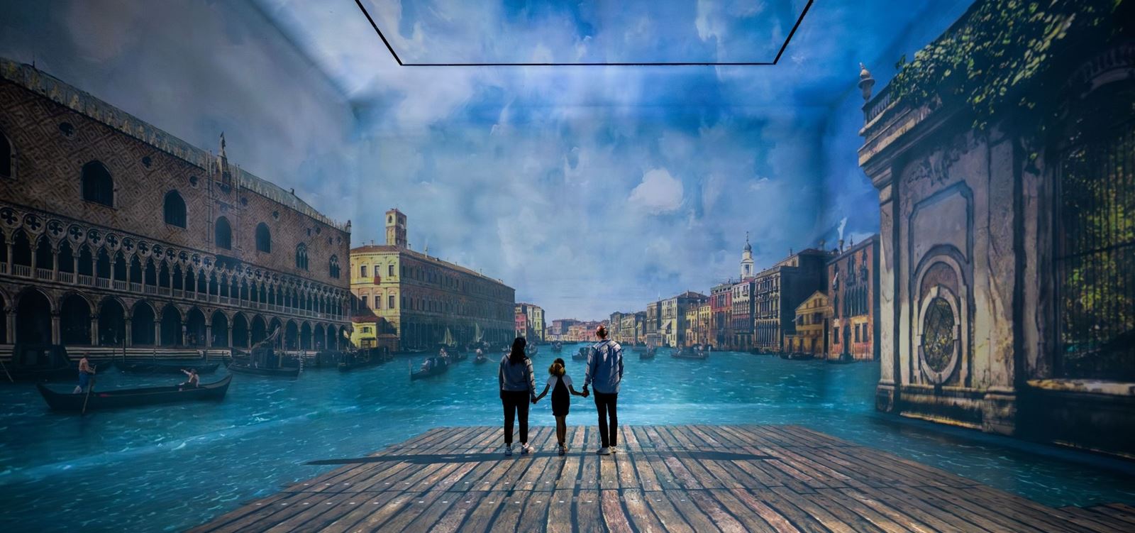 A family of three immersed in a scenic artwork