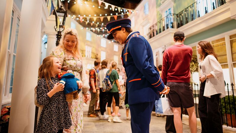 Step into the wonderful world of Paddington Bear at the exciting immersive extravaganza, The Paddington Bear Experience. Image courtesy of Alex Brenner/About Grace PR. A station master greets visitors at the Paddington Bear Experience.