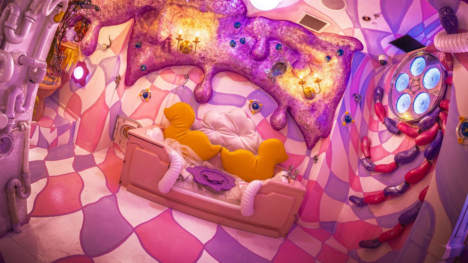 A colourful, vibrant room filled with surreal installations, and mind-bending visuals that is part of the Wake The Tiger Absurd City immersive experience