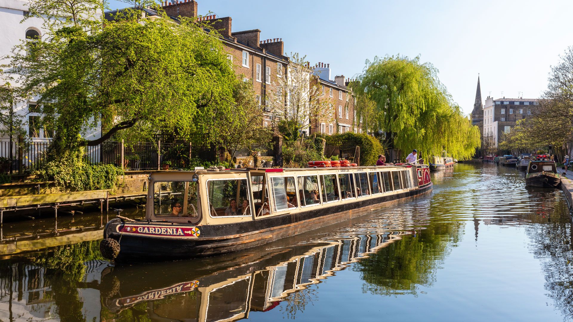 A boat travels along the water in Little Venice