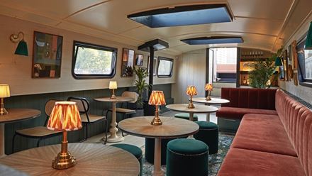 Head to The Boathouse, a floating cocktail bar moored at Wood Wharf with a charming retro fee. Credit: The Boathouse. Image courtesy of The Boathouse.