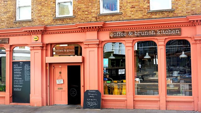 The Brown and Green Café is a café and brunch kitchen that is recognisable by its orange-painted façade and blackboards featuring the menu outside.