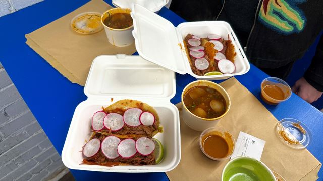 A photo of two birria taco orders at Bake Street in Stoke Newington with a side of consomme 