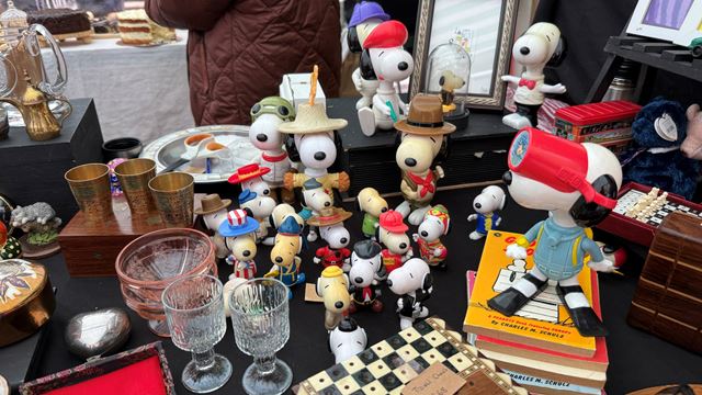 A photo of a stall at Broadway Market selling a selection of vintage items including collectable Snoopy figurines