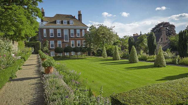 Fenton House, a red brick house dating back to the 17th century, is seen from the picturesque gardens.