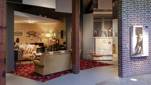 A photo of one of the displays at Museum of the Home showing a living room and kitchen