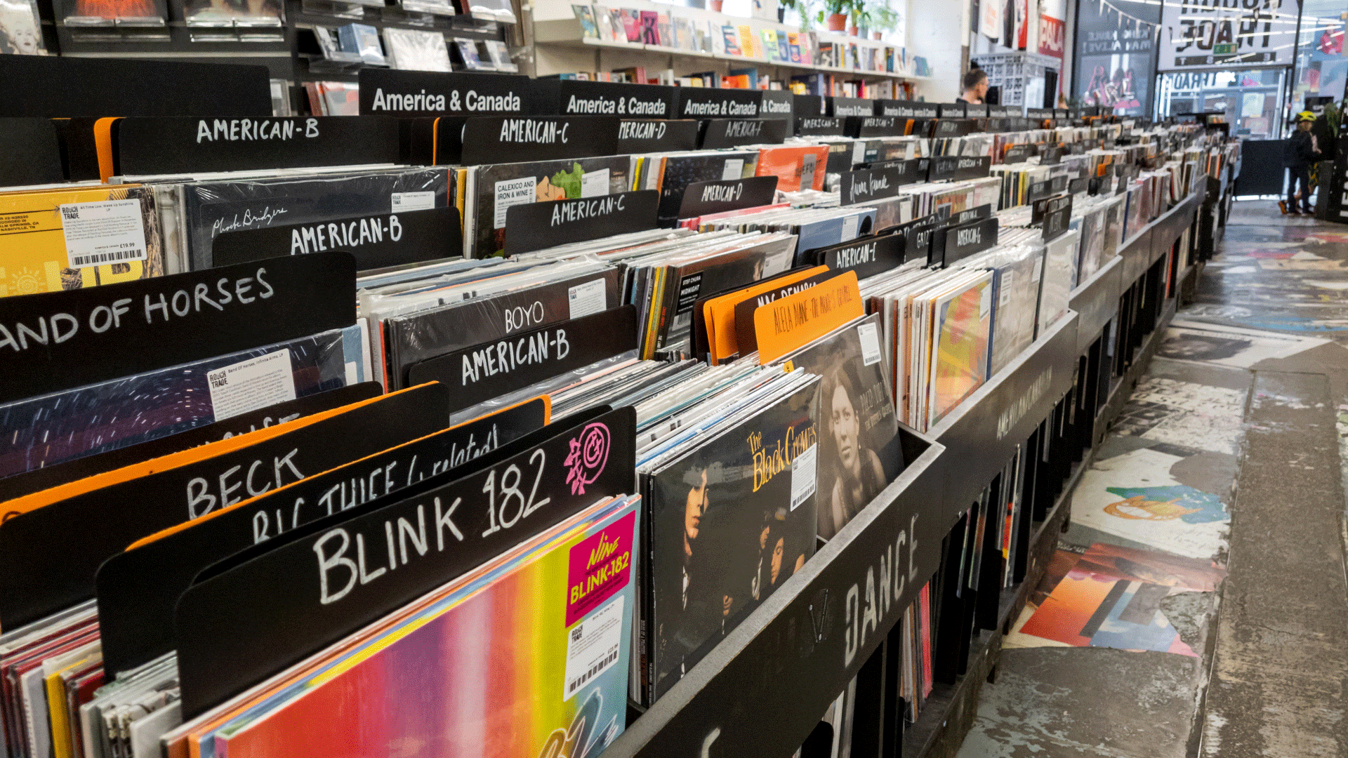 Hunt for records at Rough Trade East in Shoreditch. Credit: Shutterstock. Image courtesy of Shutterstock. Photo of different records categorised alphabetically in record store with "Blink 182" in the foreground