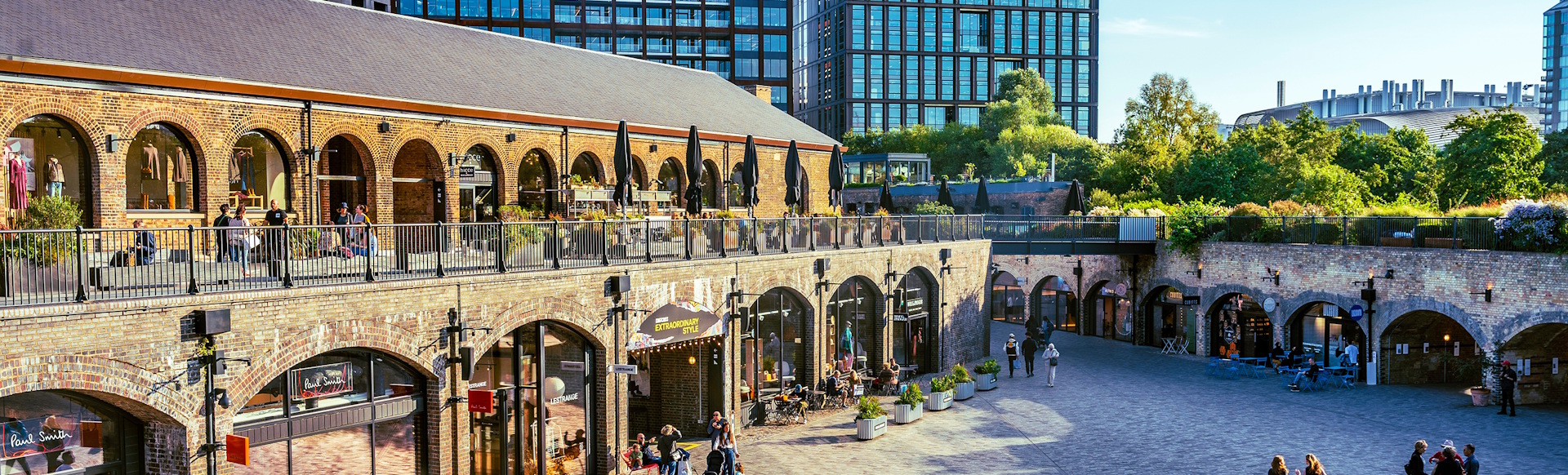 Coal Drops Yard in London's King's Cross, featuring shops, arches and pedestrianised area.