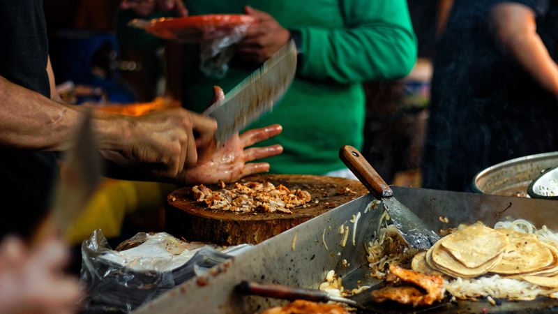 Watch chefs cook up fresh market food daily at Camden Market. Credit: Shutterstock. Image courtesy of Shutterstock.