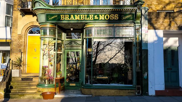Bramble & Moss flower shop with a green traditional shopfront in Chiswick