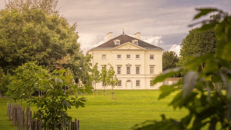 Wander around more than sixty acres of green space in the grounds of Marble Hill House. Credit: English Heritage. Image courtesy of English Heritage. Trees, bushes and a large lawn in the foreground of the stately Marble Hill House
