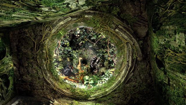An immersive art display called the Intelligence Garden at Outernet London, showing green plants and animals on the ceiling.