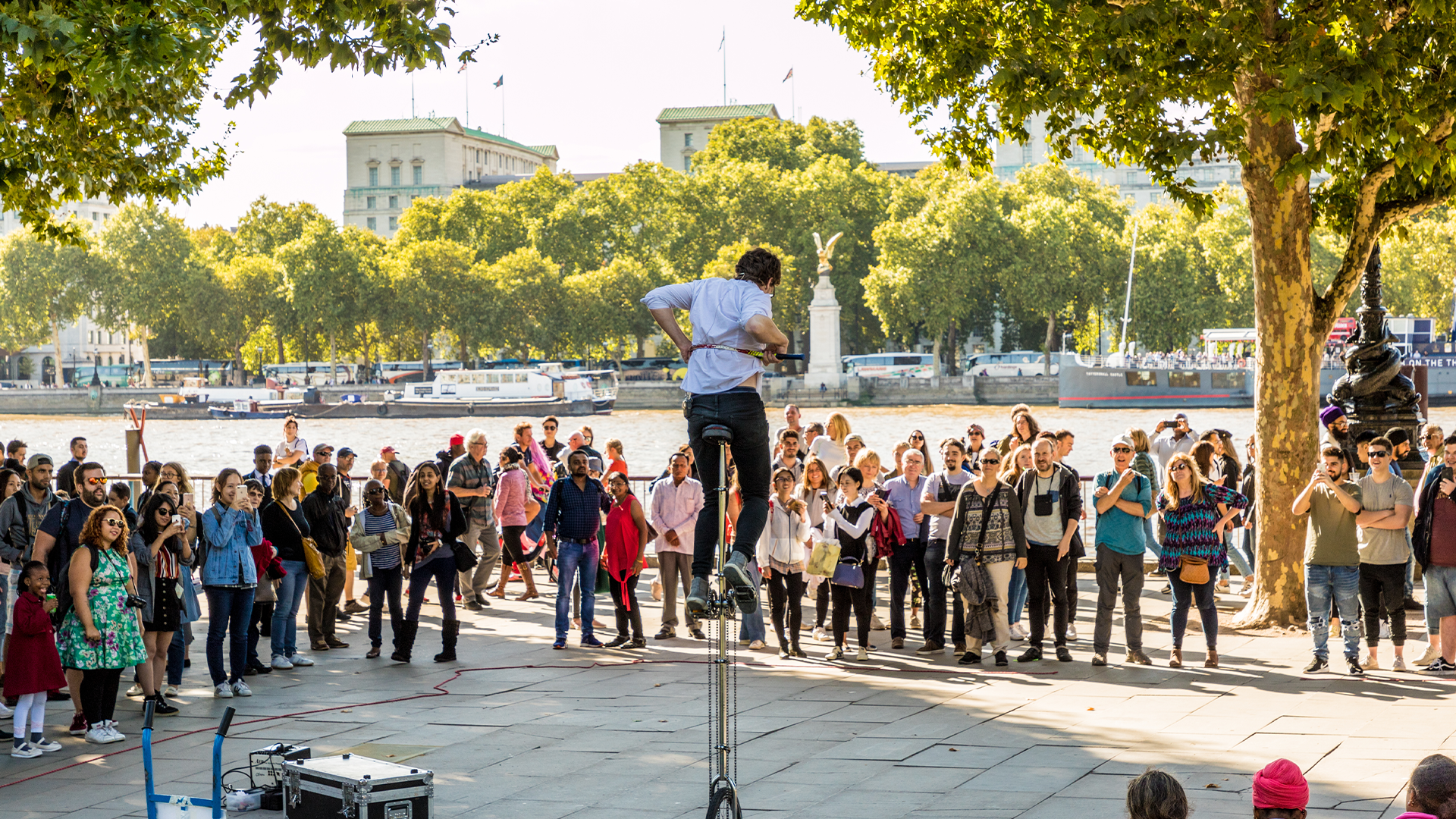 A street performer drawing large crowds along the South Bank