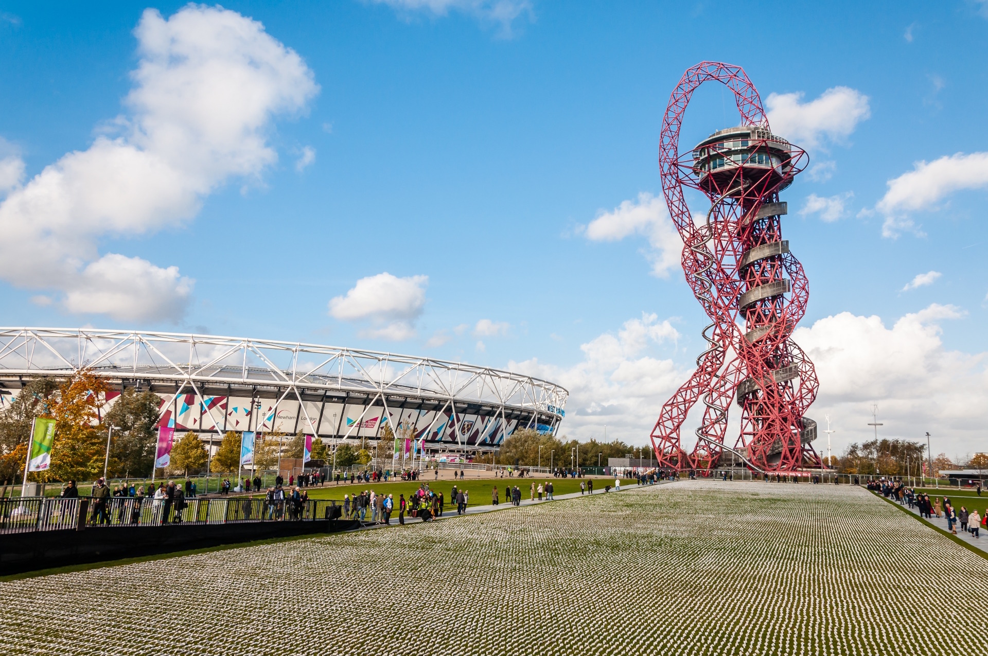 Stratford's Queen Elizabeth Olympic Park with the red ArcelorMittal Orbit sculpture and stadium in the distance.