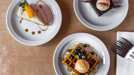 Signature dishes include the delicious plantain waffles for dessert. Credit: Naf Castanas. Image courtesy of Chuku's.