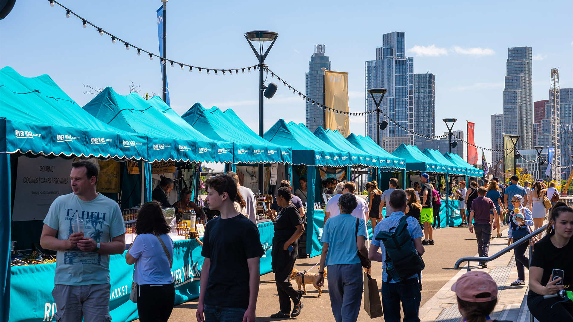 The River Walk Market at Battersea Power Station pictured against skyline.