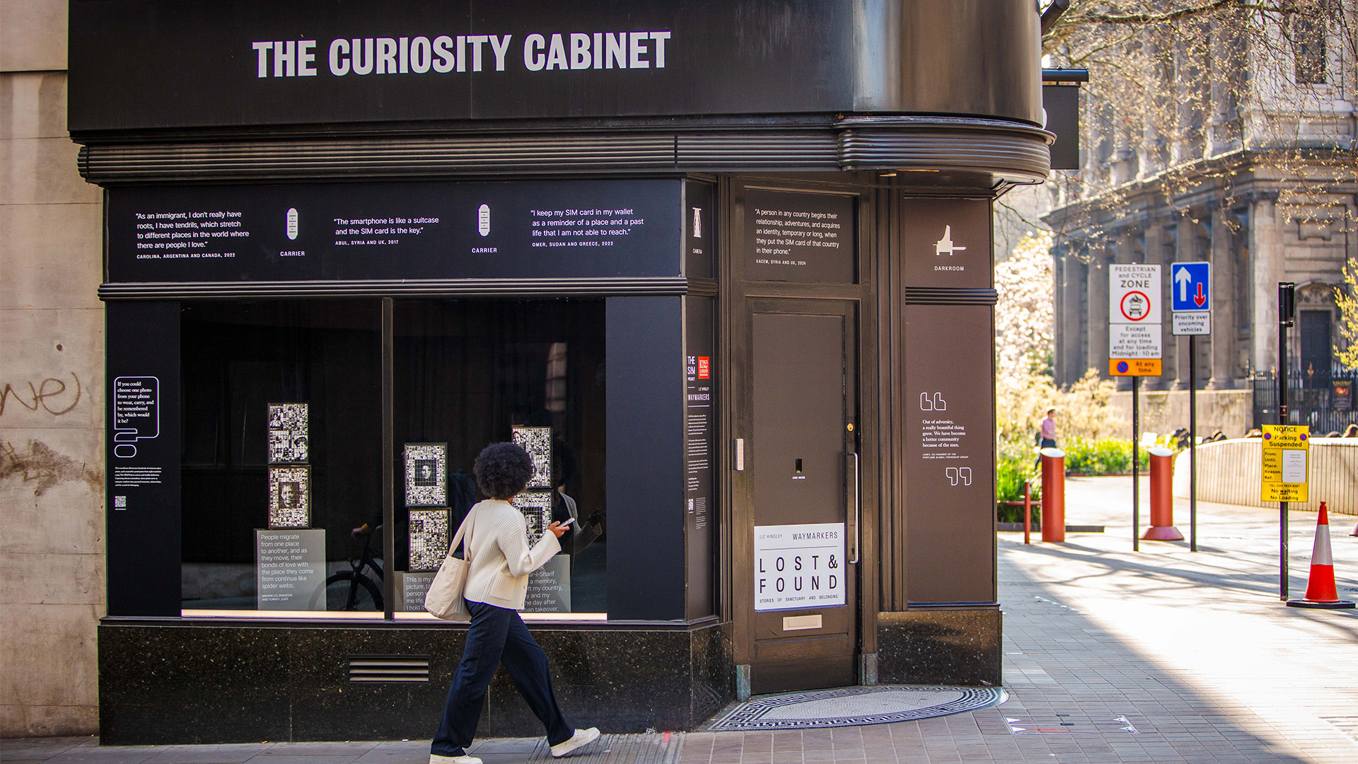 King’s College London, ‘The Curiosity Cabinet’ for London Design Biennale 2025. Image courtesy of London Design Biennale/Jack Latimer. A woman walks past a building in London