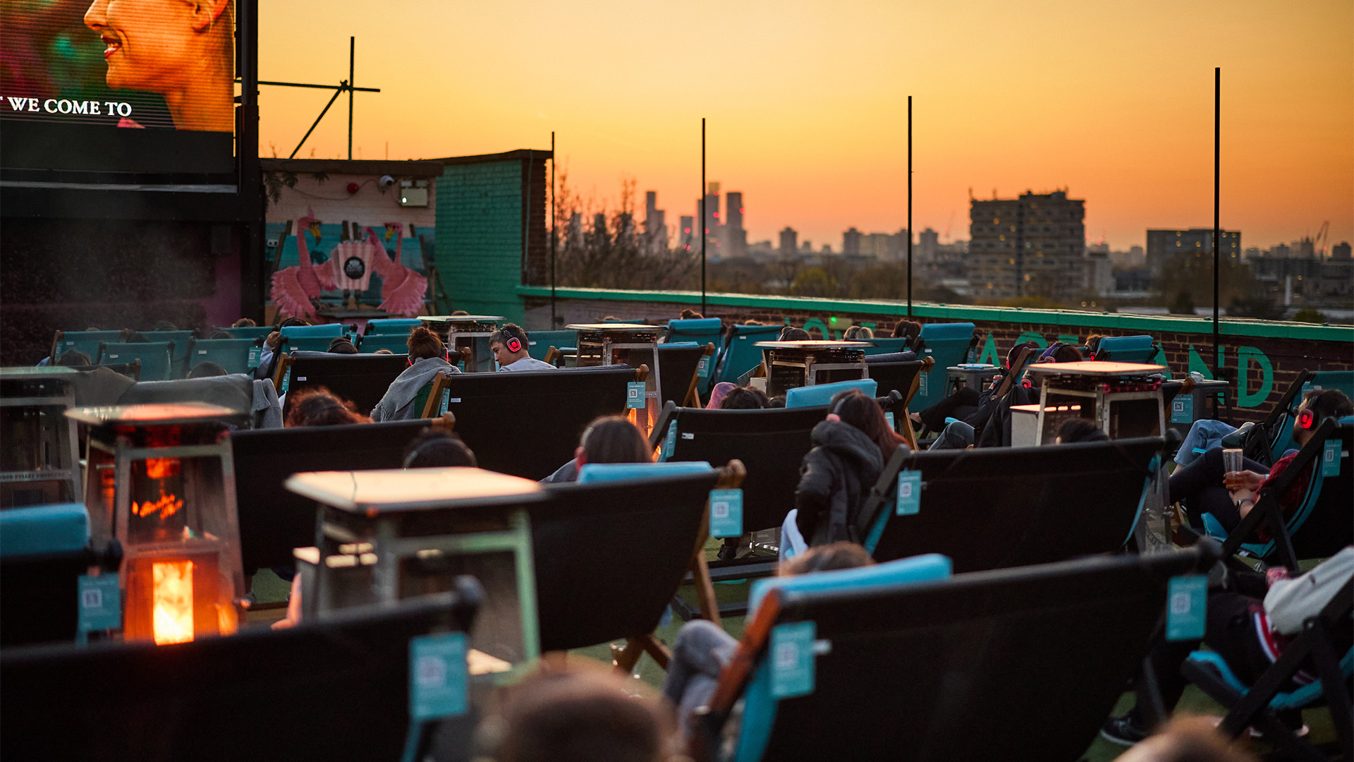 Catch a film beneath the stars at Rooftop Cinema Club in Peckham. Image courtesy of Rooftop Cinema Club. Sunset at Rooftop Film Club in Peckham