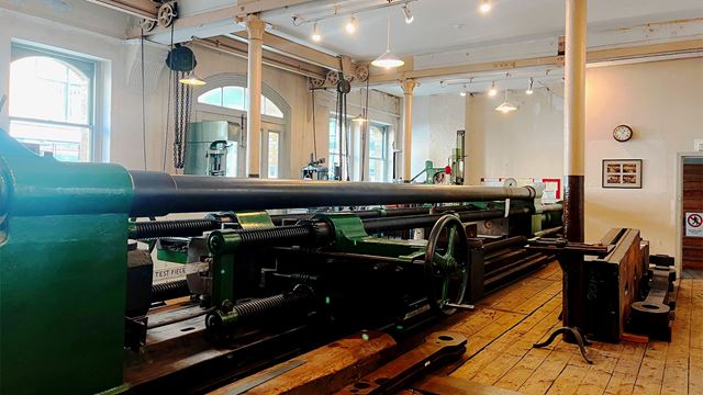 The Kirkaldy machine, a cylindrical tool that takes up the entire length of the room, is the highlight of the tour and is still in working order.