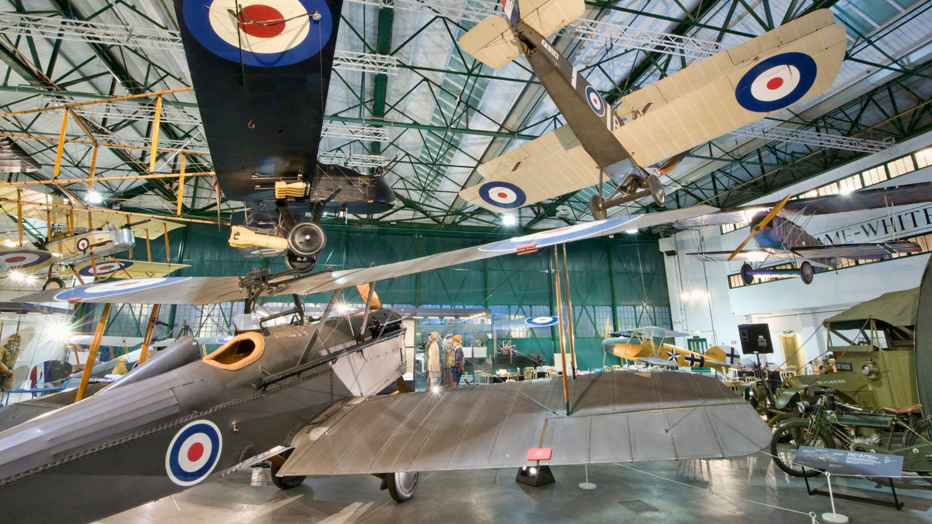 Multiple aircraft on display in hanger at Royal Air Force Museum.