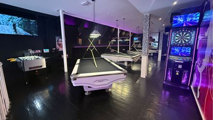 Pool tables, a dartboard and foosball table in the bar. Image courtesy of 1920 Bar.