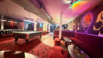 A seating area and pool tables in the bar. Image courtesy of 1920 Bar.