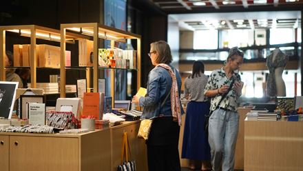 People browsing at the Barbican Shop. Credit: Rachel Shnapp. Image courtesy of the Barbican.
