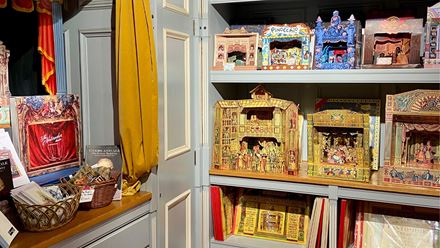 Shelves displaying intricate paper theatres. Image courtesy of Benjamin Pollock's Toyshop.