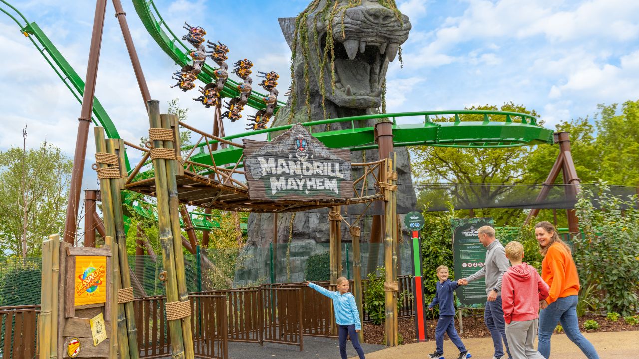 The Mandrill Mayhem rollercoaster at the Chessington World of Adventures resort. Image courtesy of Chessington World of Adventures. A family of five about to ride the Mandrill Mayhem rollercoaster at the Chessington World of Adventures resort.