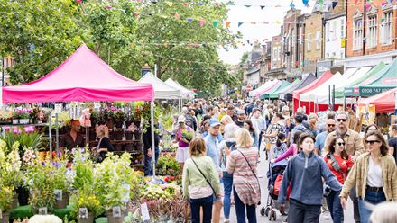 People walking through the flower market. Credit: Anna Kunst Photography. Image courtesy of Chiswick Flower Market.