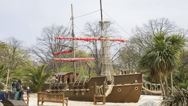 A side view of the wooden pirate ship in the playground at the Diana, Princess of Wales Memorial Garden.