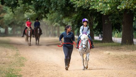A child on a horse. Credit: Nicole Ciscato. Image courtesy of Hyde Park Stables.