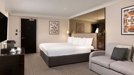A deluxe studio king room. Image courtesy of L + R Hotels.