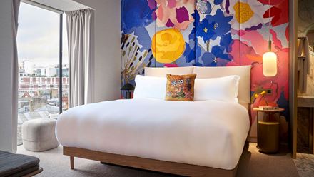 A vibrant Lane Suite at The BoTree London, Curio Collection by Hilton. Image courtesy of Hilton.