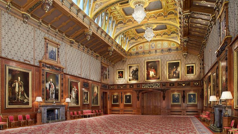 Marvel at the opulence of the Queen's Gallery at Windsor Castle. Image courtesy of Royal Collection Trust/Peter Smith. A grand room filled with paintings and a high ceiling of gold in windsor castle.