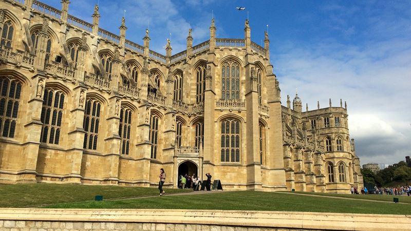 Admire the grand St George's Chapel at Windsor Castle. Image credit: Malgorzata Bujalska. Image courtesy of Unsplash. The exterior of gothic-style St George's Chapel at Windsor Castle on a clear day with blue skies.