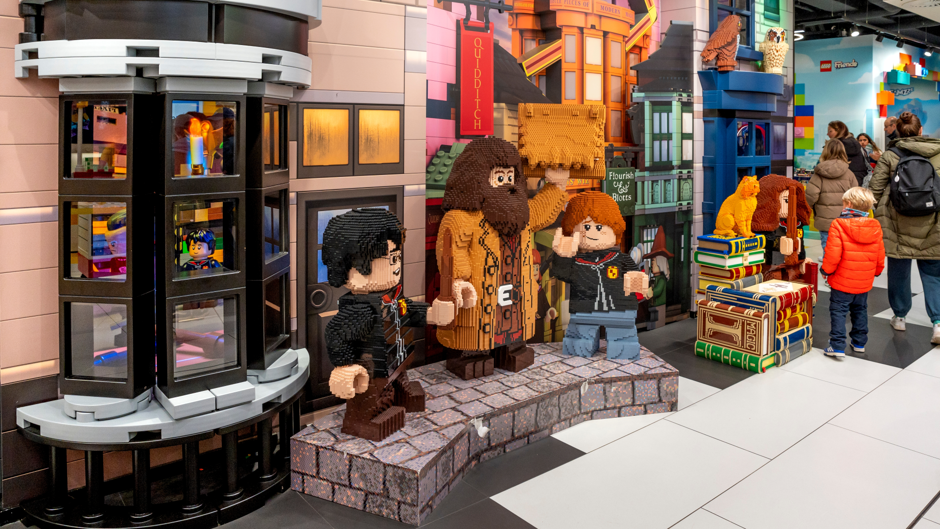 A display in the Lego store made entirely from Lego featuring Harry Potter, Hagrid and Ron Weasley with a background of the settings from the films