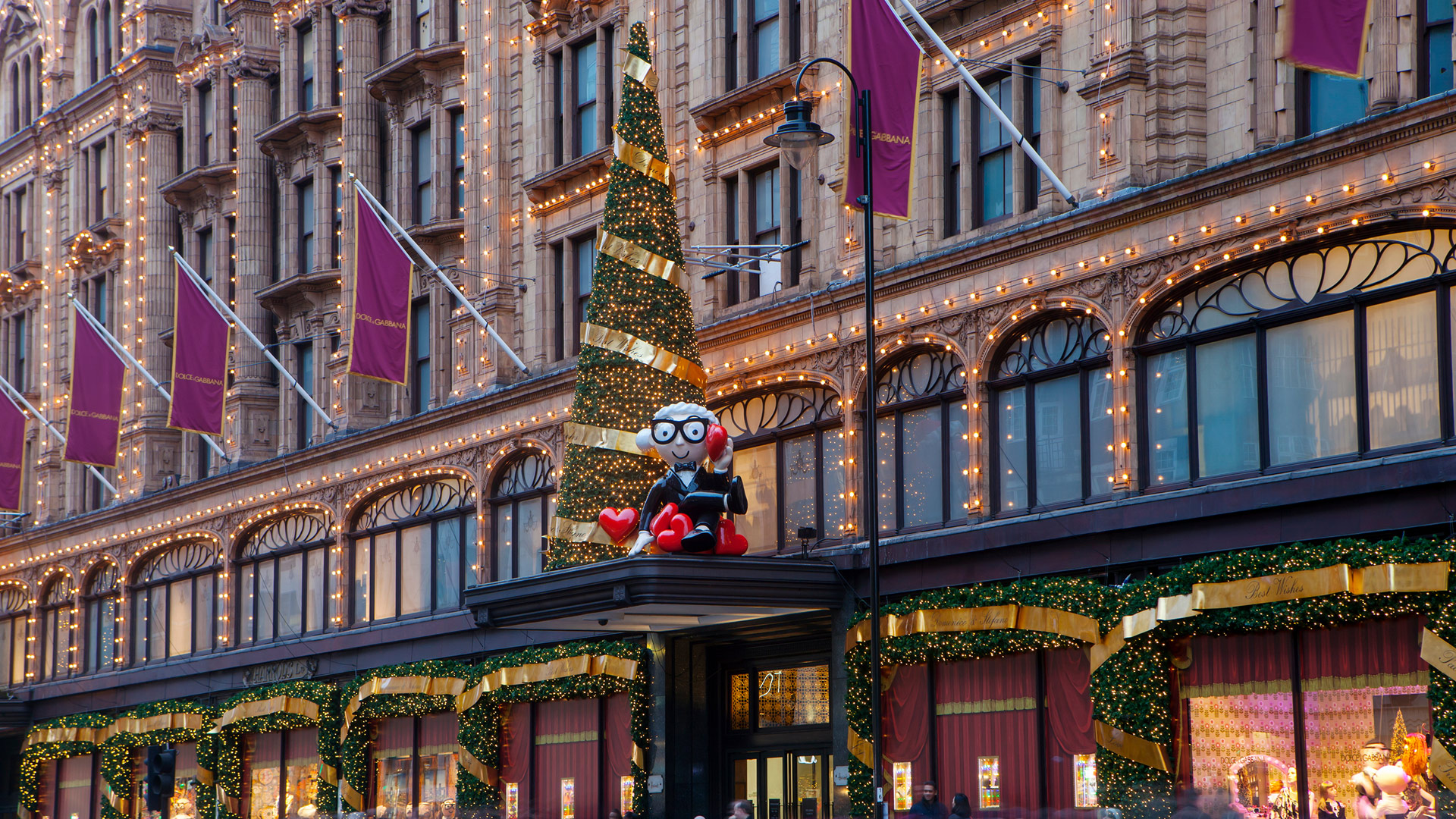 From sparkling lights to festive delights Harrods offers the ultimate Christmas experience © Magdanatka. Image courtesy of Shutterstock. The glittering exterior of Harrods adorned with lights, flags, special features and a Christmas tree