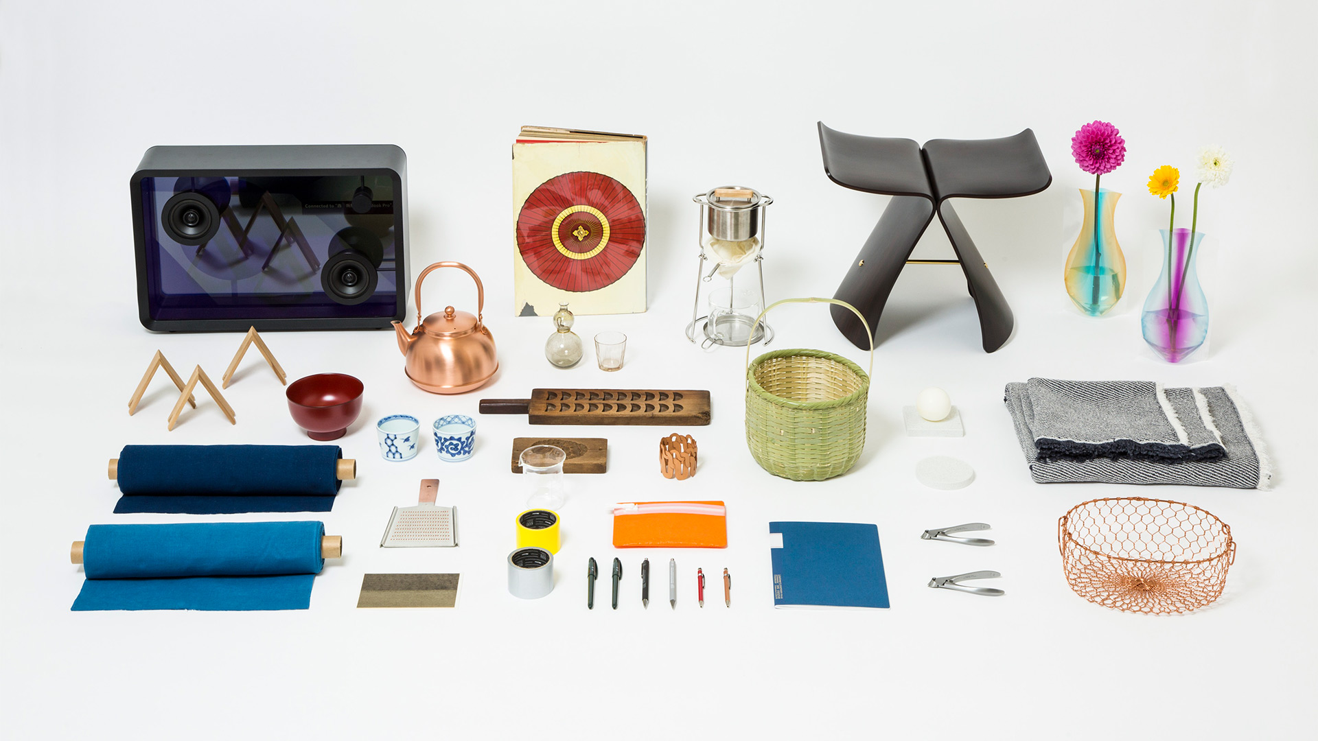 A selection of Japanese objects for sale at Japan House London, including stationary, tableware and furniture.