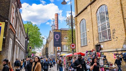 Hunt for a bargain among the stalls and shops at bustling Brick Lane, home to a number of different markets which take place over the week. Credit: Mo Wu. Image courtesy of Shutterstock.