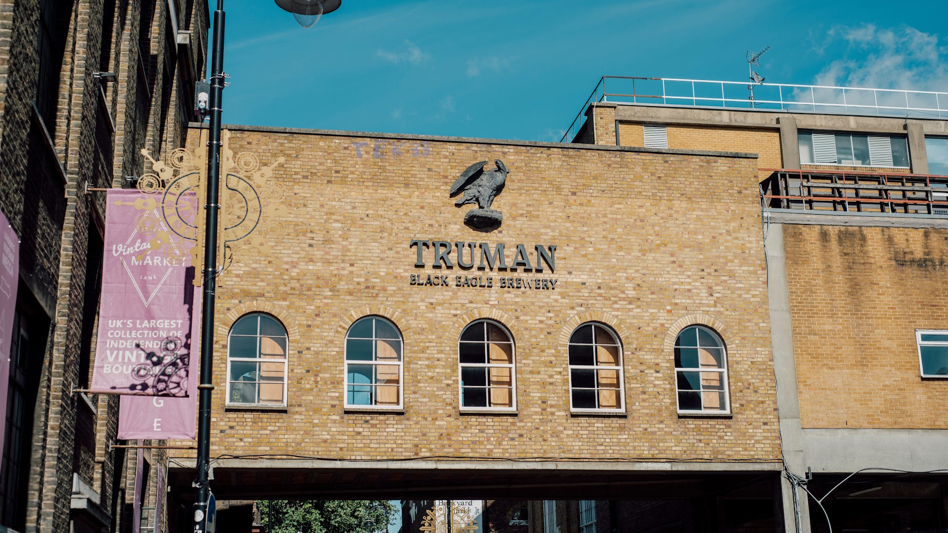 Black Eagle Brewery's brick building with blue sky.
