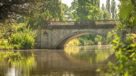 Admire the ornate stone bridge spanning the lake at Chiswick House and Gardens. Image courtesy of Chiswick House & Gardens Trust. Image credit: Andre Pattenden.