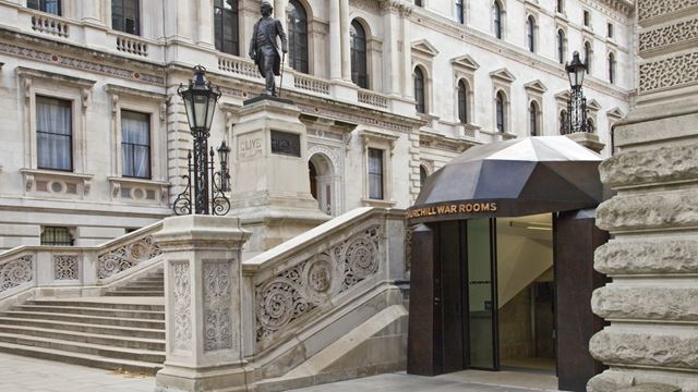 Discreet entrance to the Churchill War Rooms beside stairs in Westminster, central London.