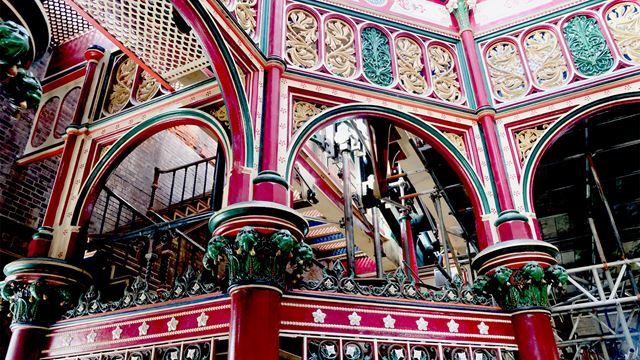 The Crossness Pumping Station's beam engine house boasts stunning ironwork in shades of gold, red and green.