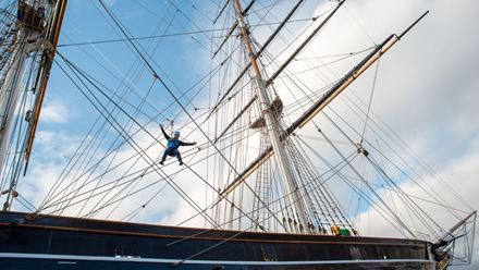 Experience panoramic views across London's skyline at the Cutty Sark Rig Climb Experience. Image courtesy of Golden Tours.