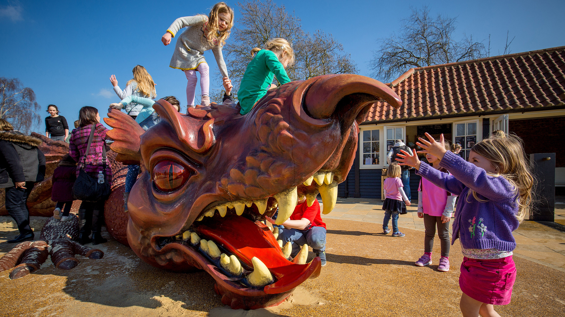 Children playing on the dragon at The Magic Garden, Hampton Court