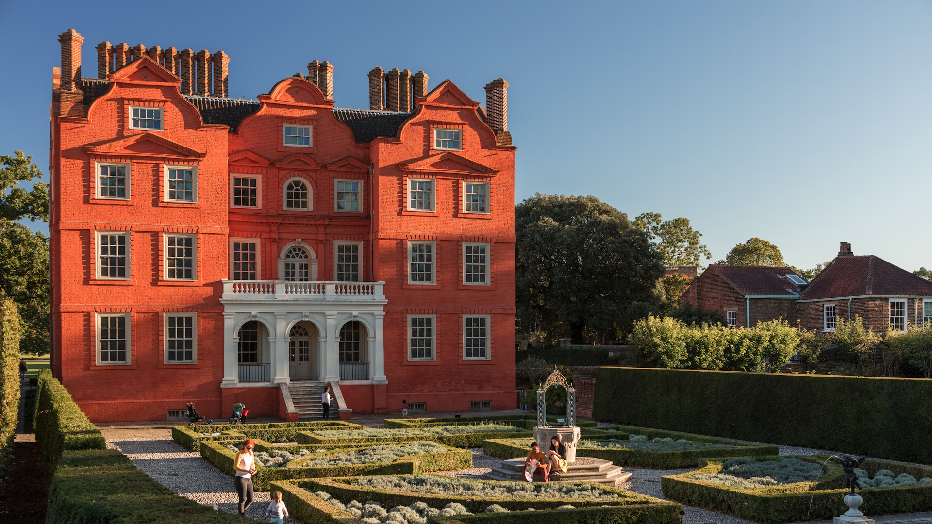 View on Kew Palace and its gardens on a sunny day.